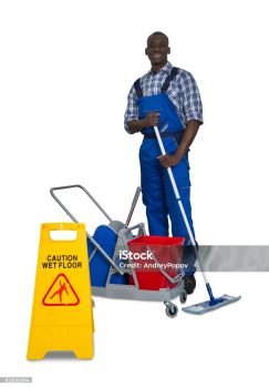 Young African Male Janitor Cleaning Floor With Mop And Cleaning Equipment On White Background